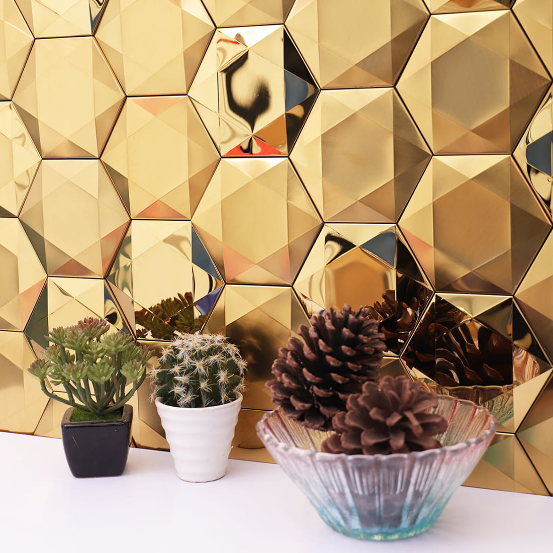 Angle view of 3D gold hexagon metallic wall tiles and home decor.