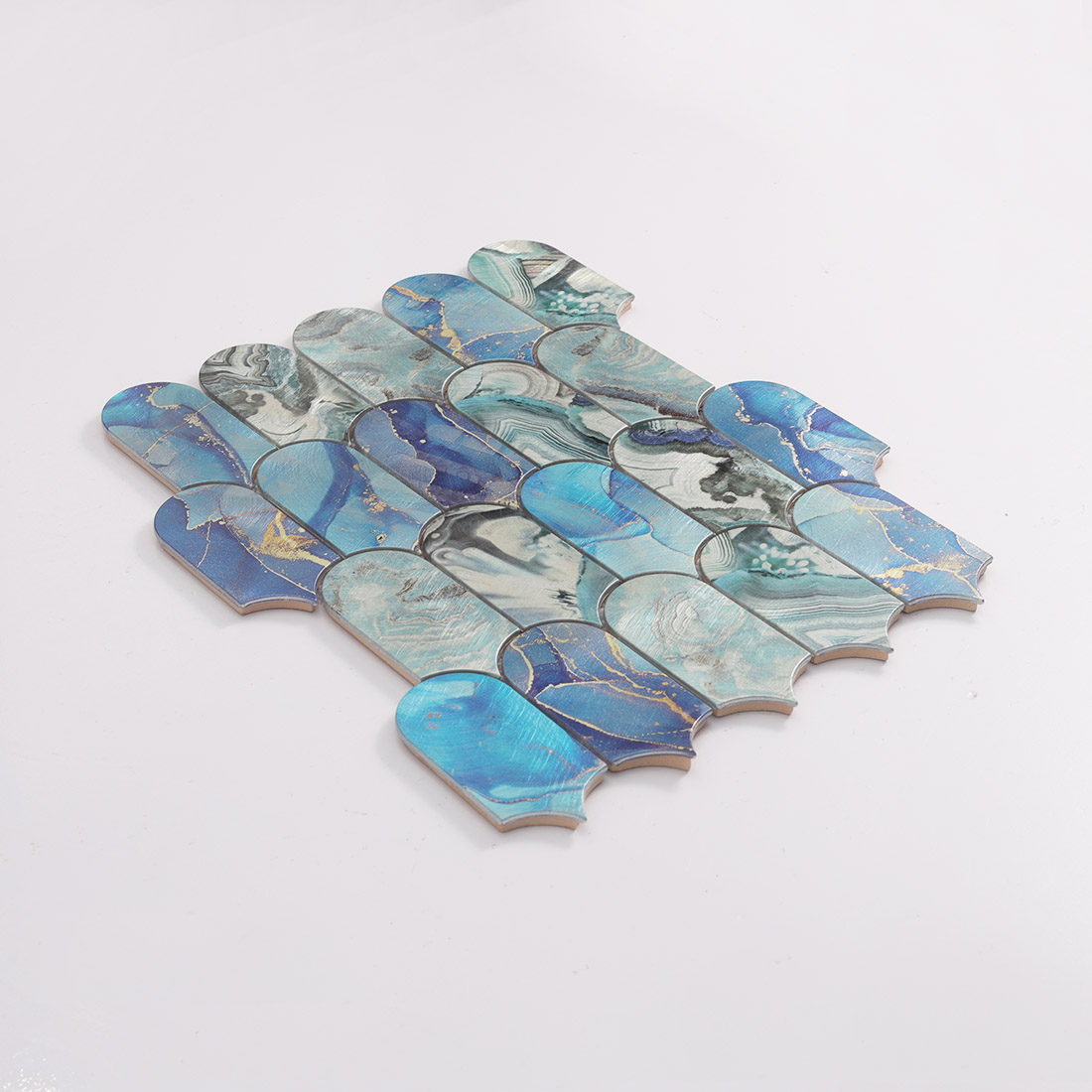 Angled view of blue rounded arch aluminum mosaic tile with stone style pattern