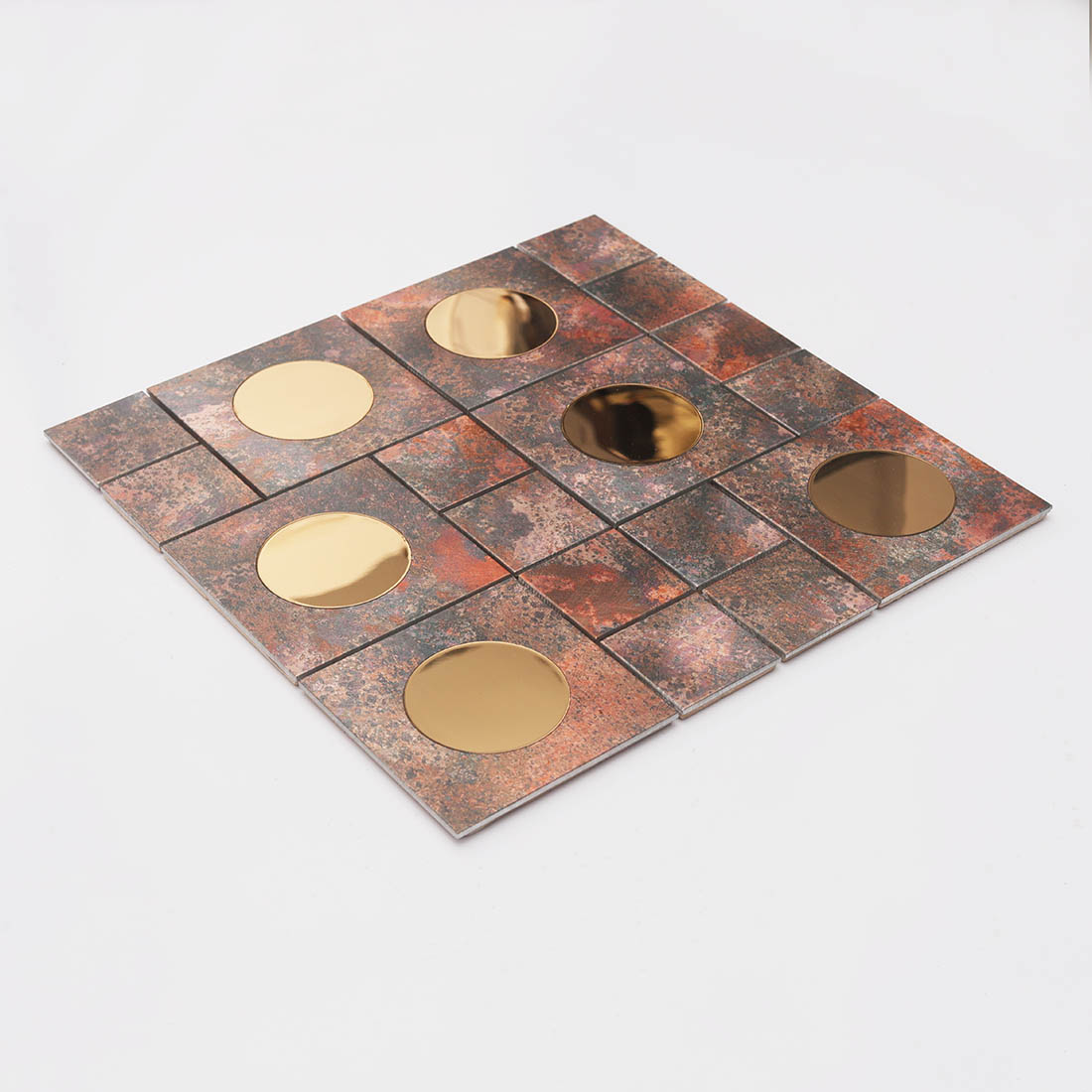 Angled view of copper aluminum mosaic tile with round mirror glass inserts