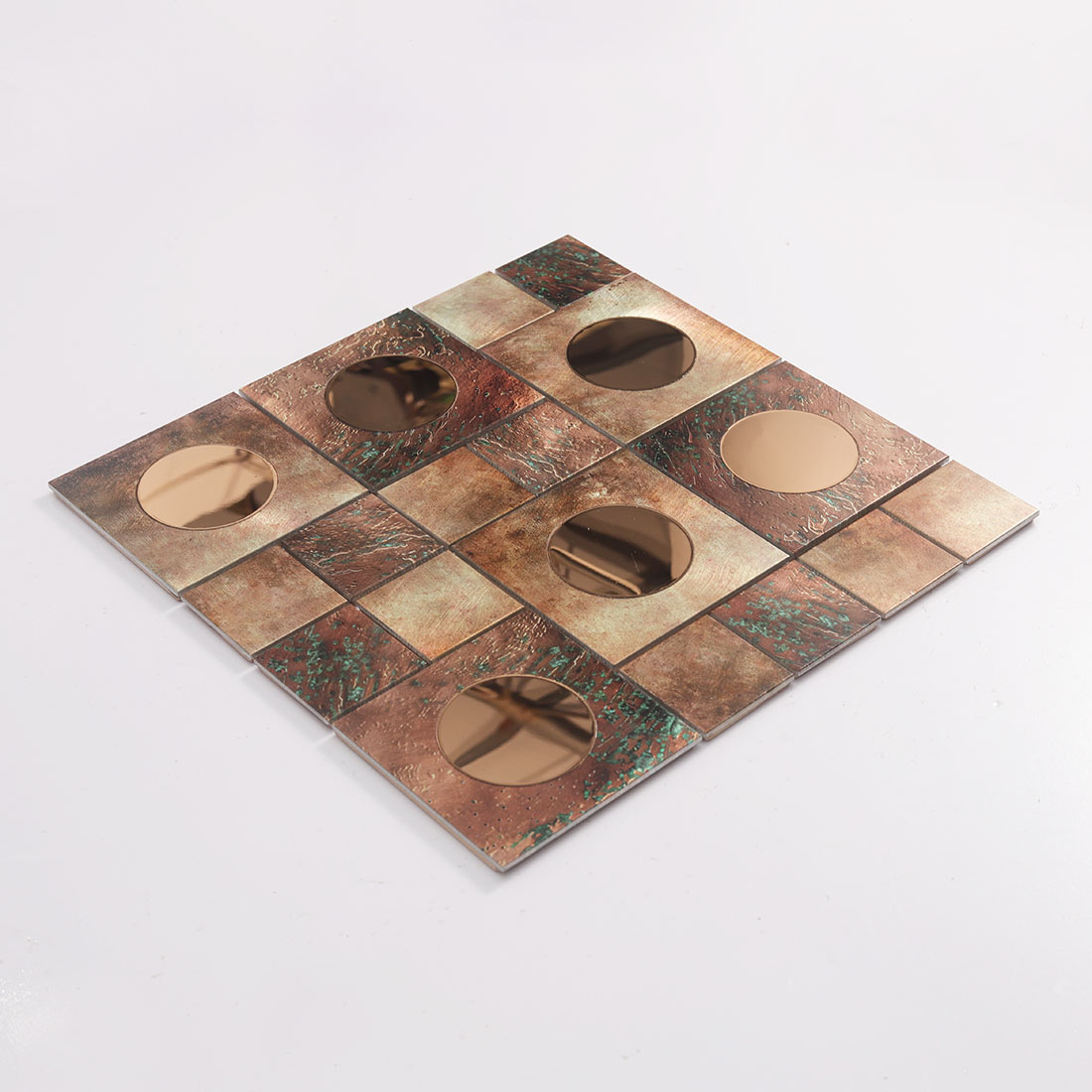Angled view of copper aluminum mosaic tile with round rose gold mirror glass