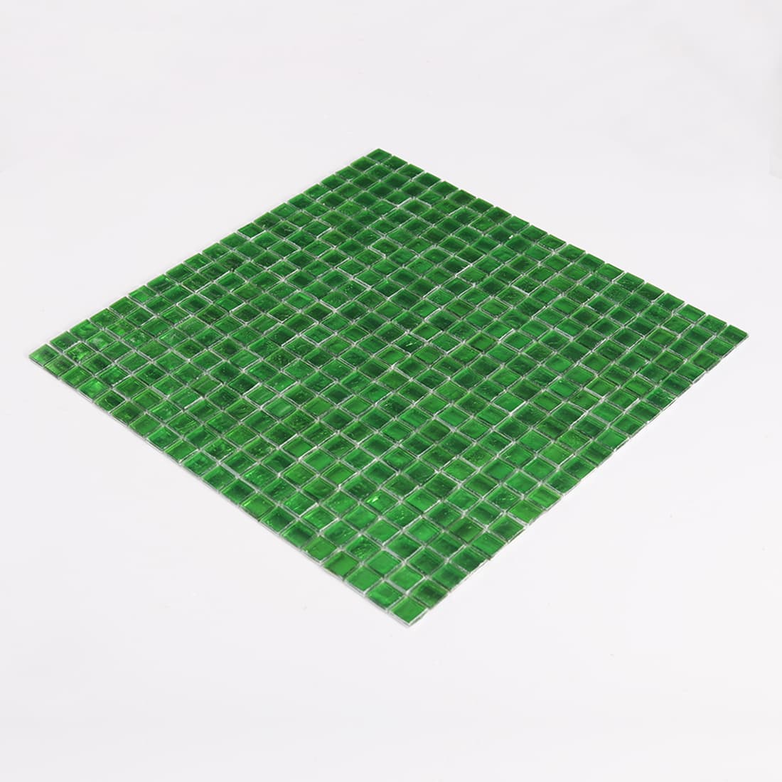 Angled perspective shot of complete bright green glass mosaic tile sheet 