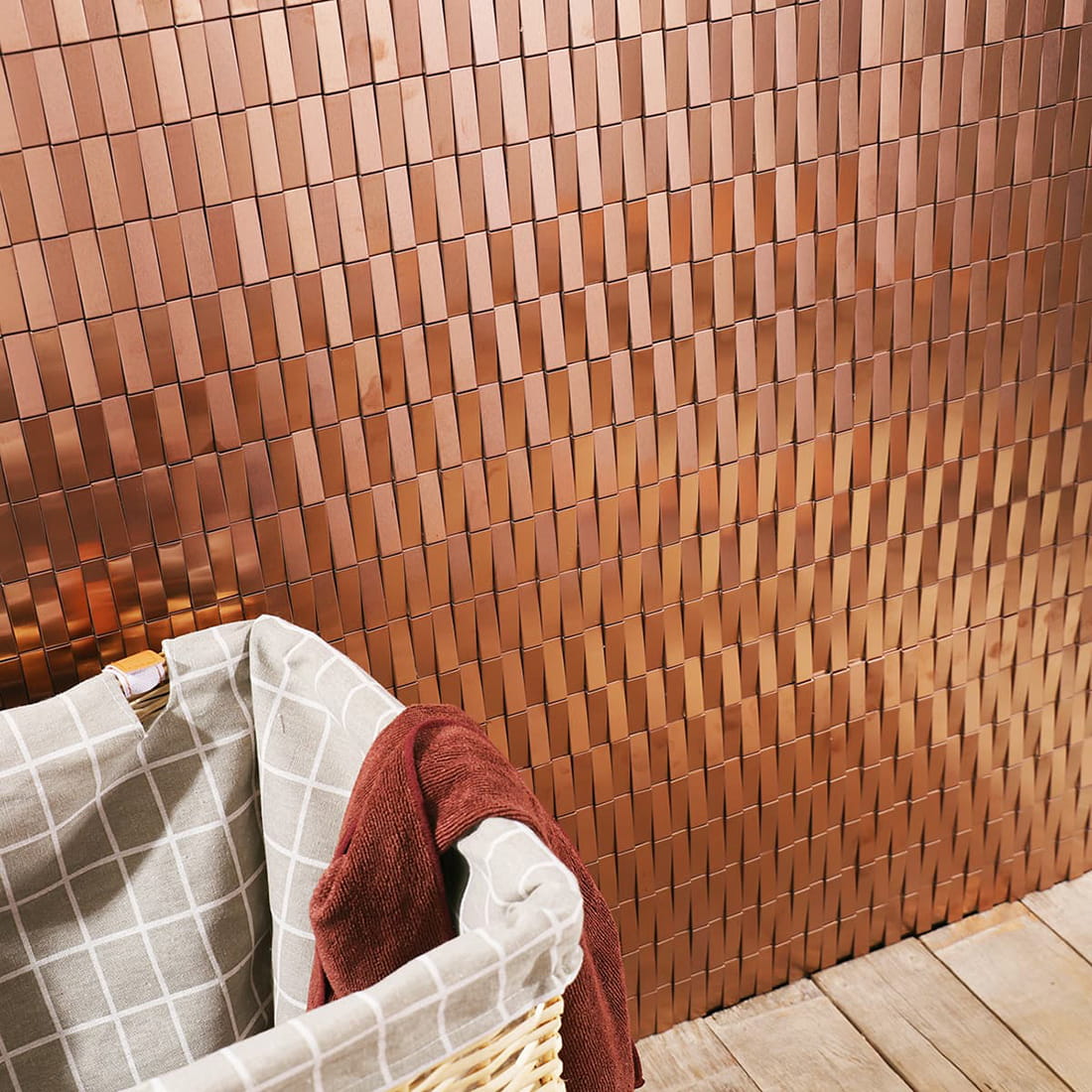 Angled close-up of an installed rose gold 3D metal mosaic feature wall.