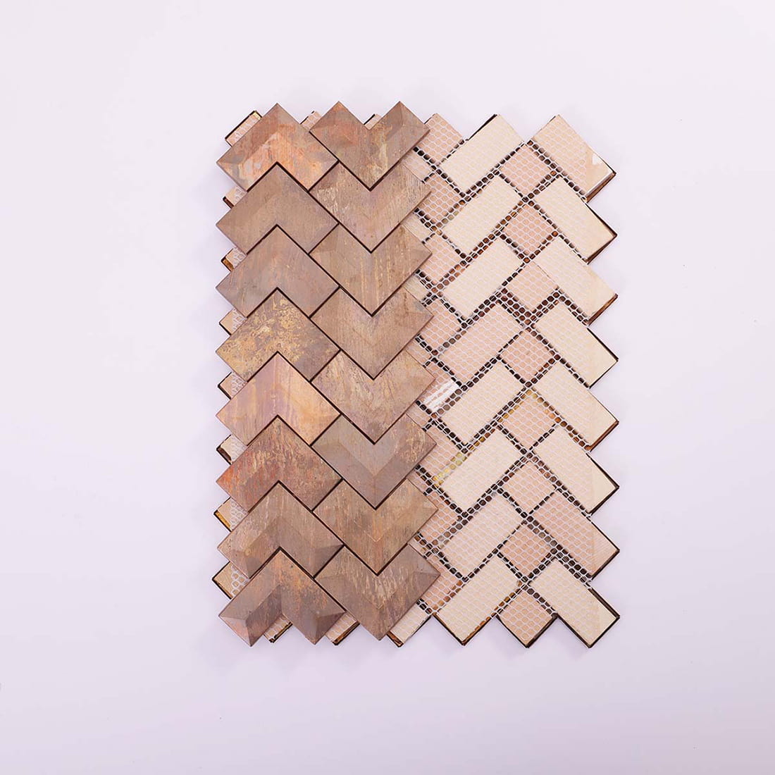 Rear view of antiqued copper chevron tiles showing the fiber mesh backing.
