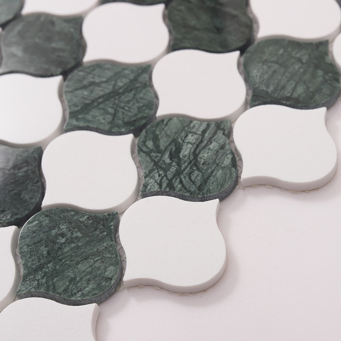 Side angle close-up highlighting the arabesque mosaic surface texture