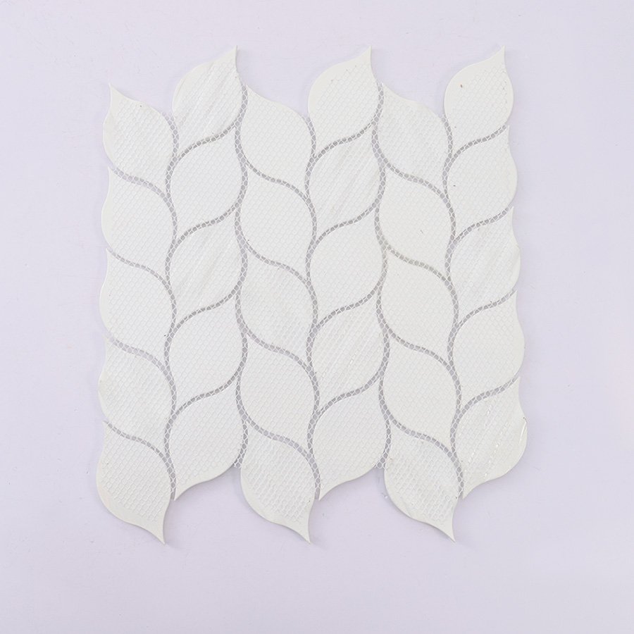 Backside of white glass iridescent leaf mosaic tile sheet with mesh backing.