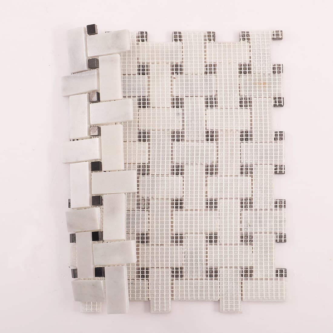 Back view of Carrara white basketweave marble mosaic tile with fiberglass mesh backing.