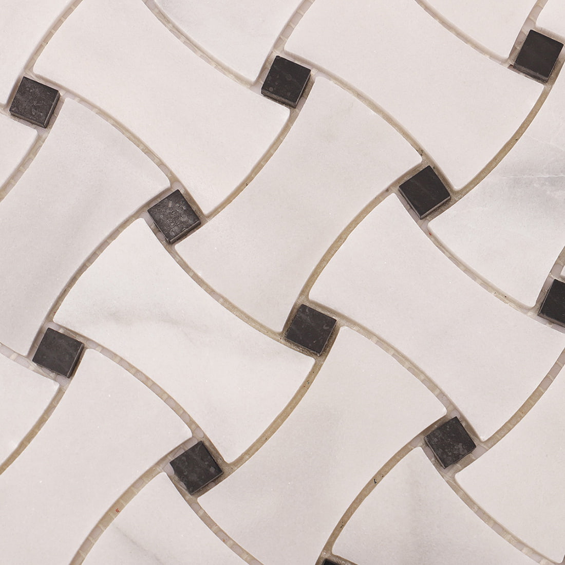 Close-up of basketweave pattern marble mosaic with black dot corner insets.