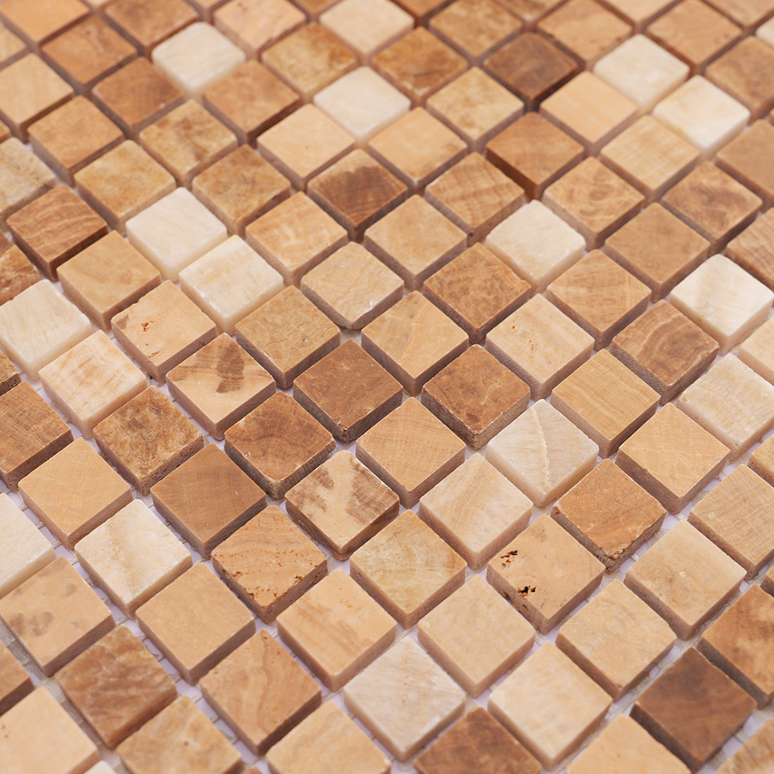 Close-up of beige brown square marble mosaic tiles with natural stone veining