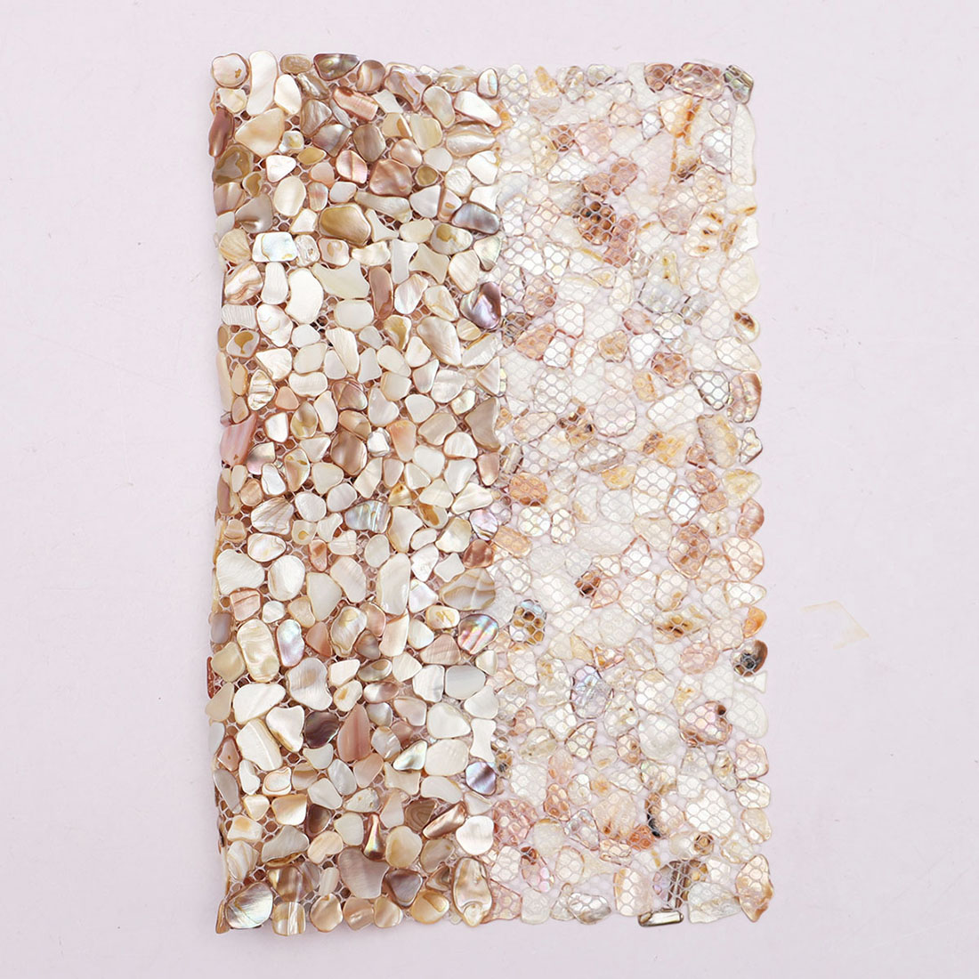 Mesh backing view of beige iridescent mother of pearl pebble mosaic tile