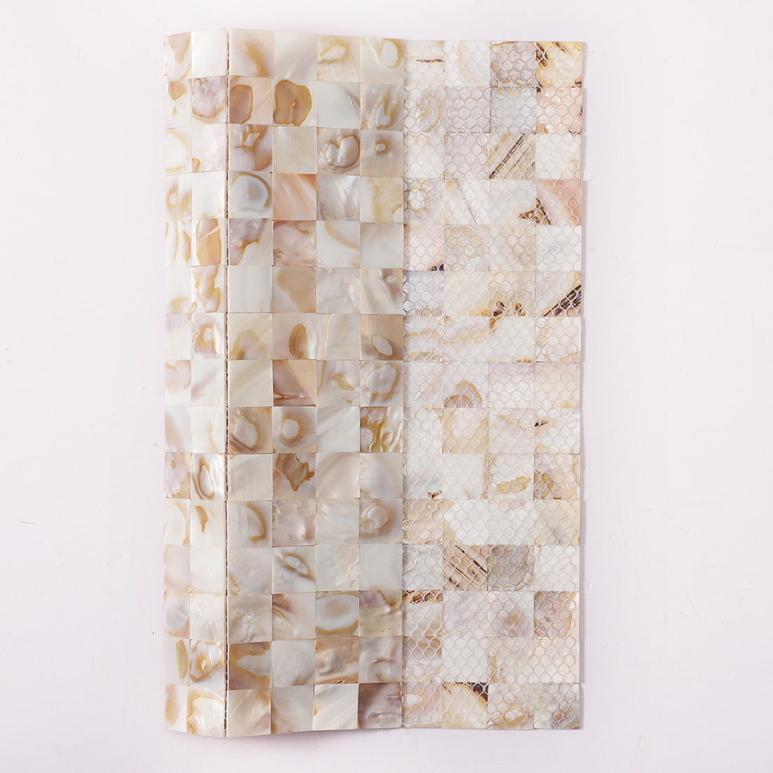 Side view of beige natural shell mosaic sample board showing mesh backing