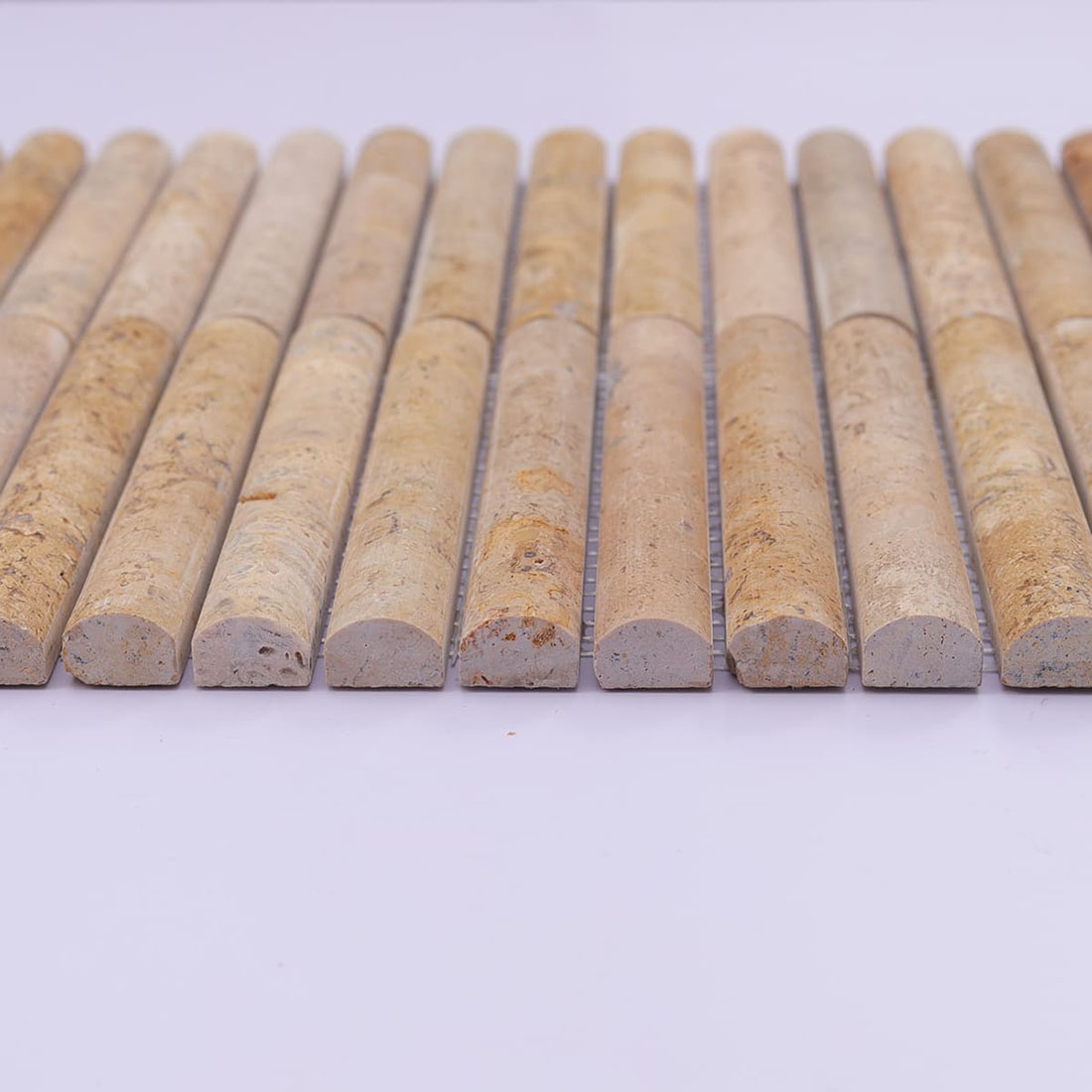 Front profile of beige travertine mosaic showing the half-round strip surface