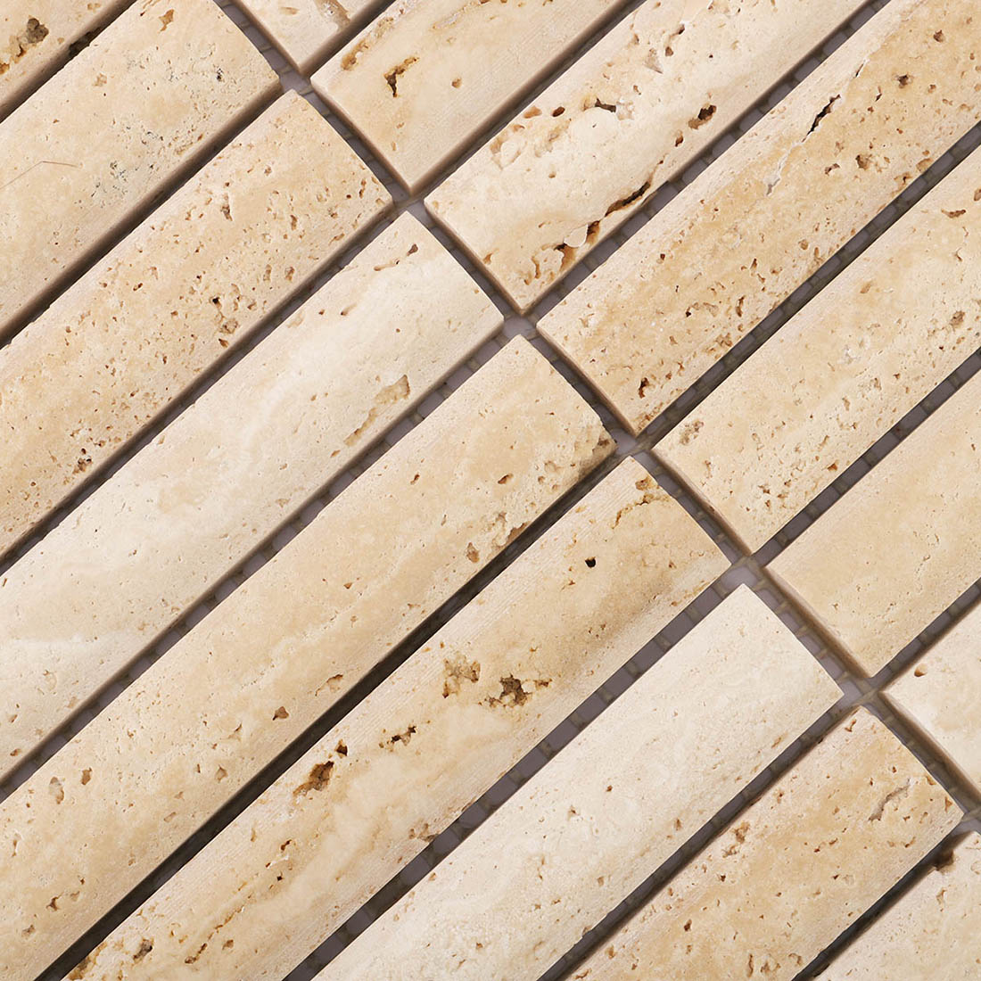 Detailed beige travertine strip mosaic with distinctive natural stone cavities