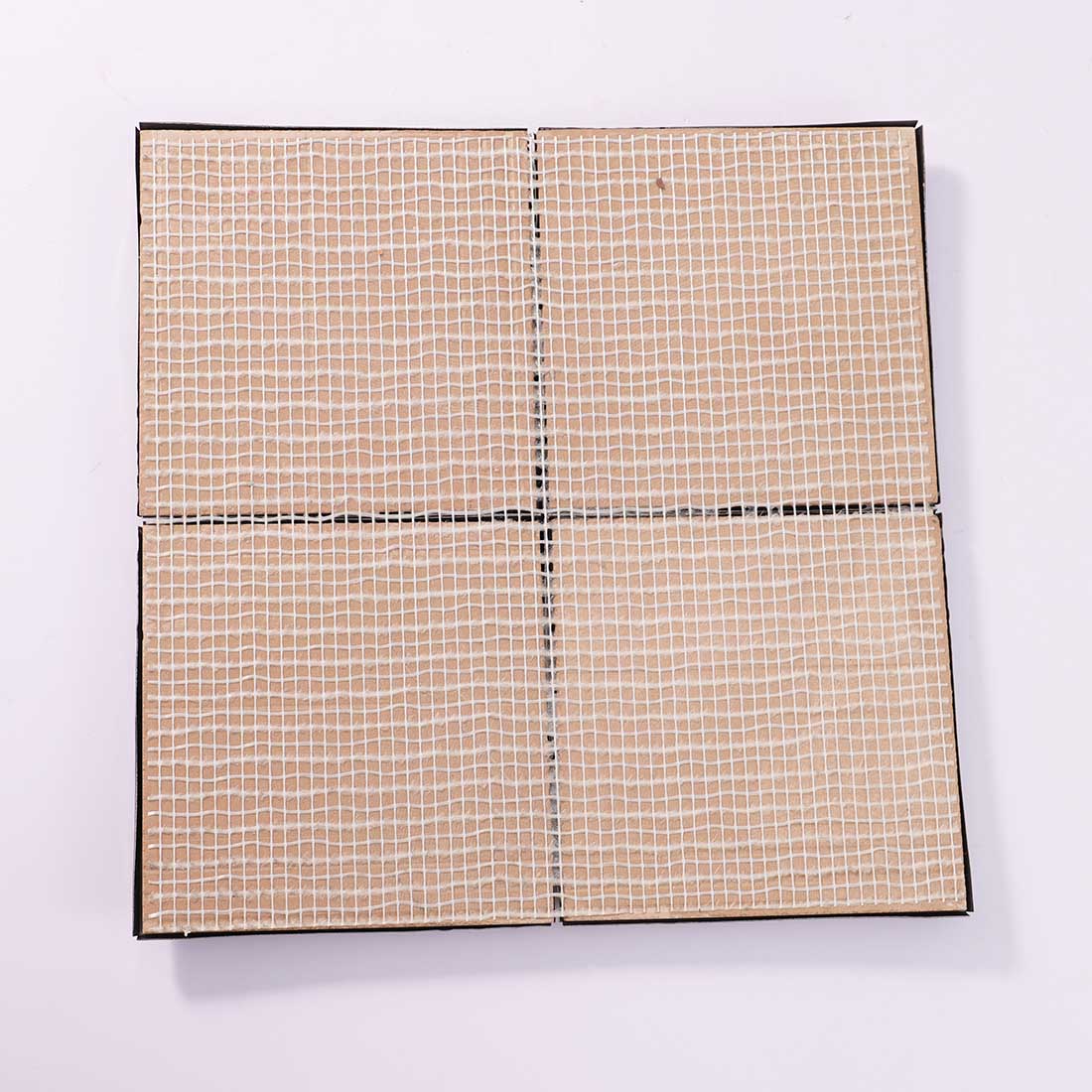 Back view of black 3D stainless steel mosaic tiles with mesh-mounted backing