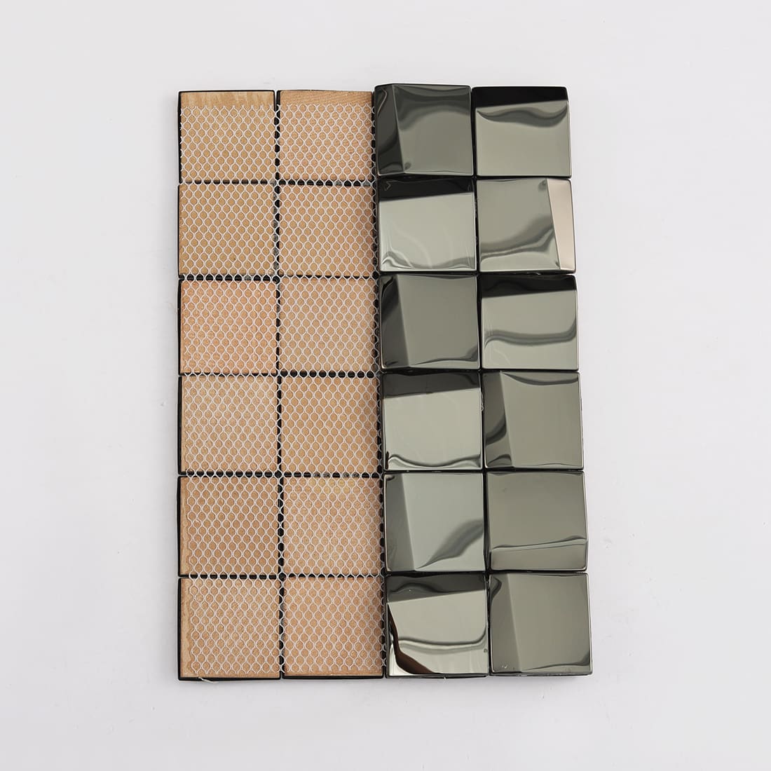 Back view of a black 3D mosaic tile sheet showing the fiber mesh connection.