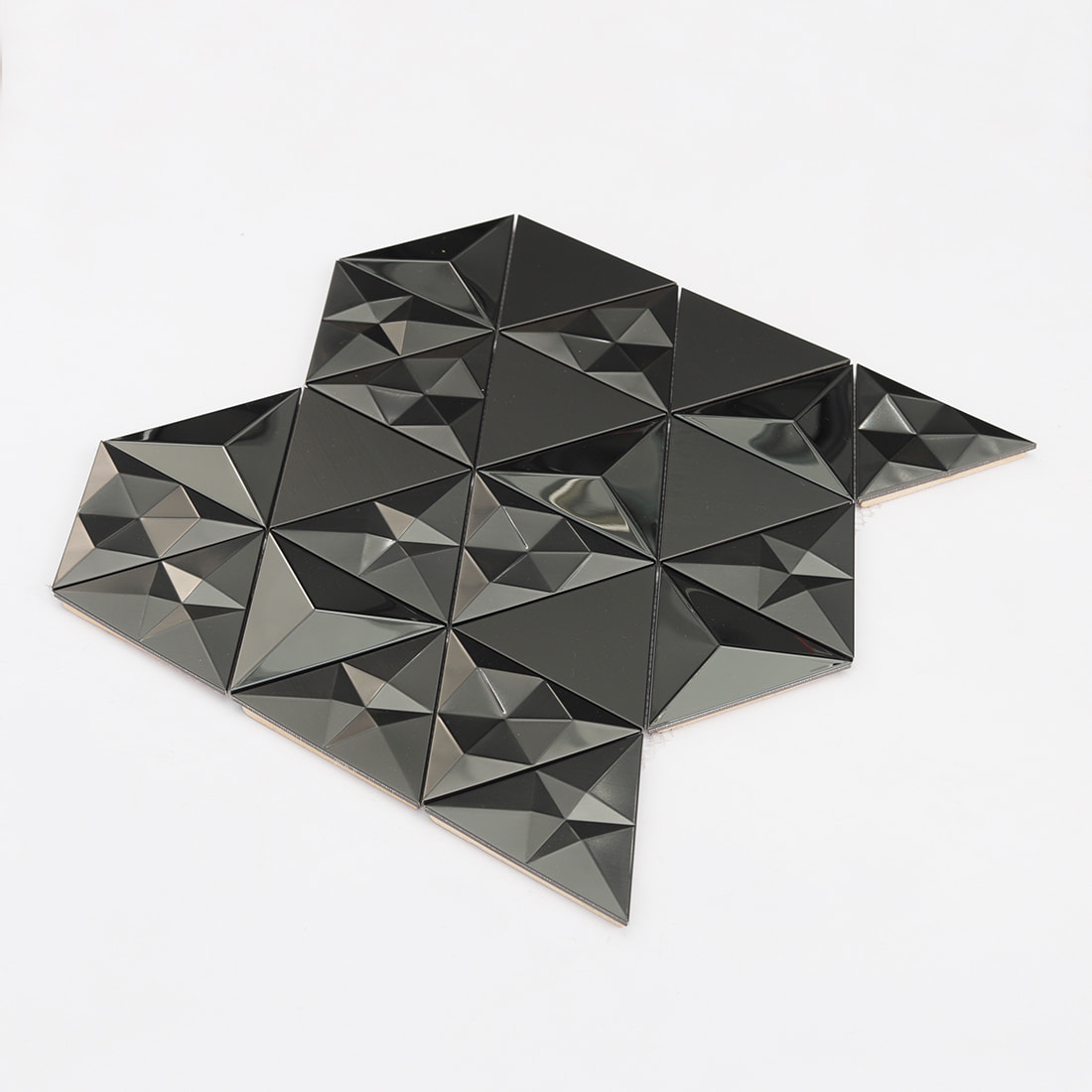 Angled display of black 3D triangle stainless steel mosaic with mixed shine