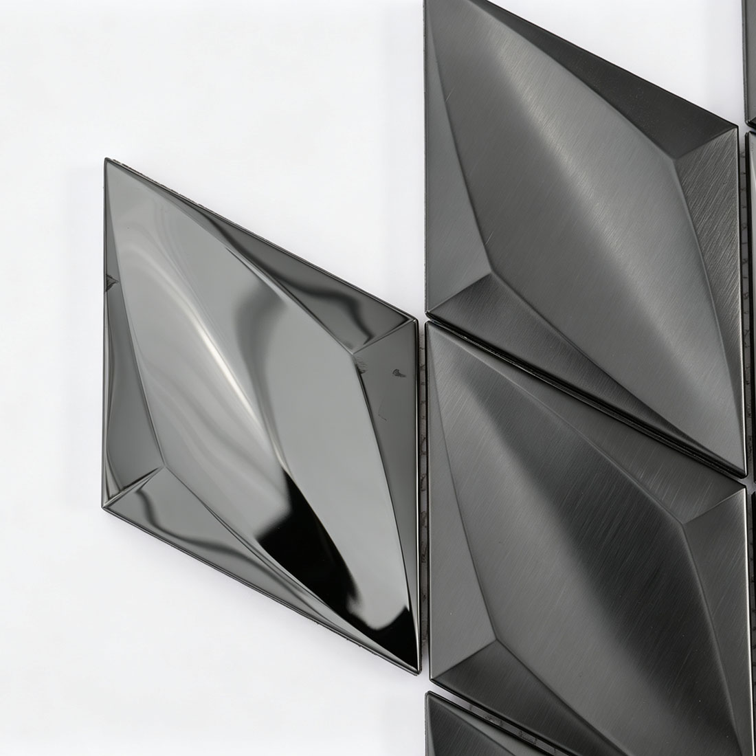 Corner detail of black diamond metal mosaic tiles