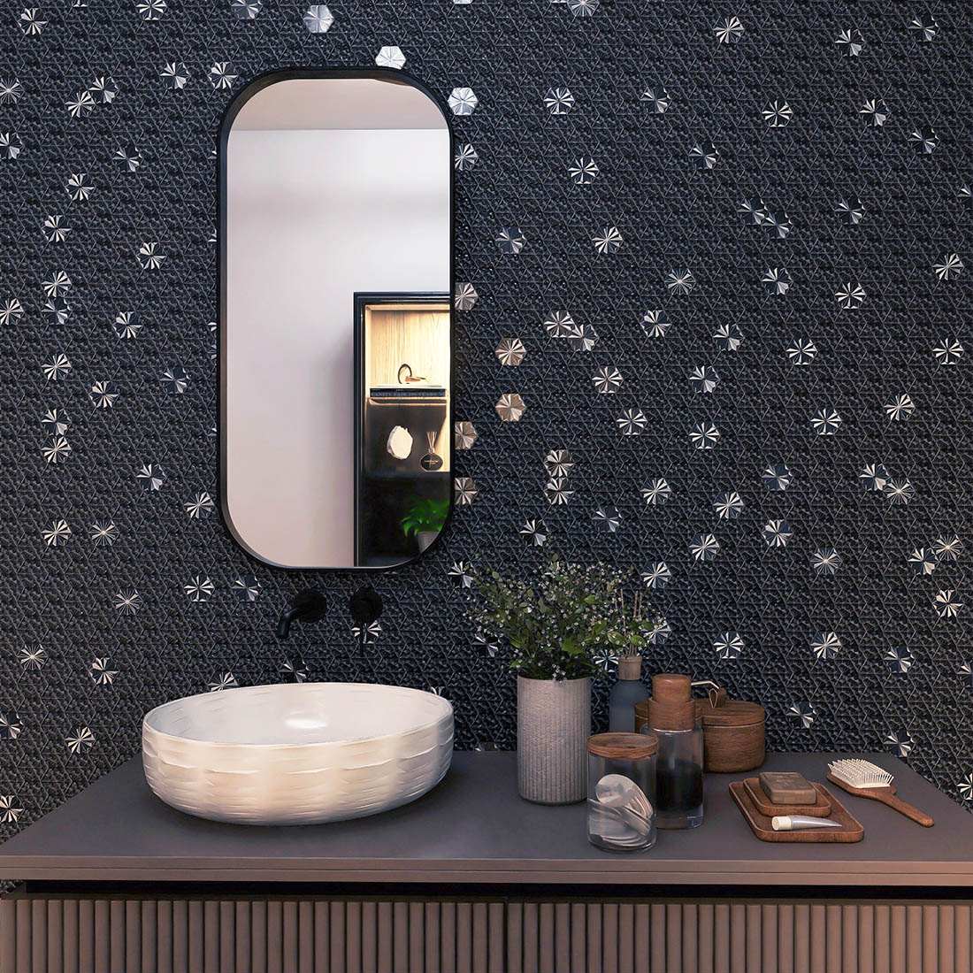 Black geometric metal mosaic tile wall behind a modern bathroom vanity