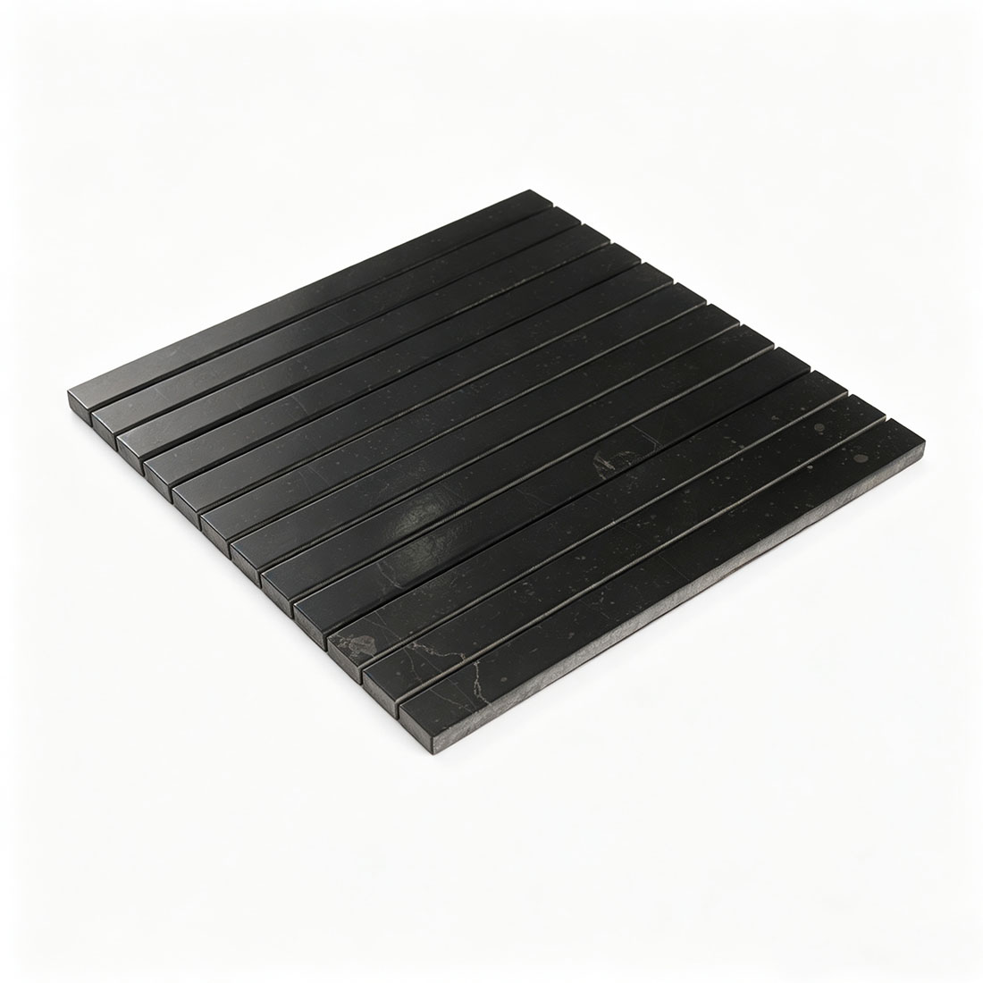Angled view of black marble mosaic tile with long narrow strips