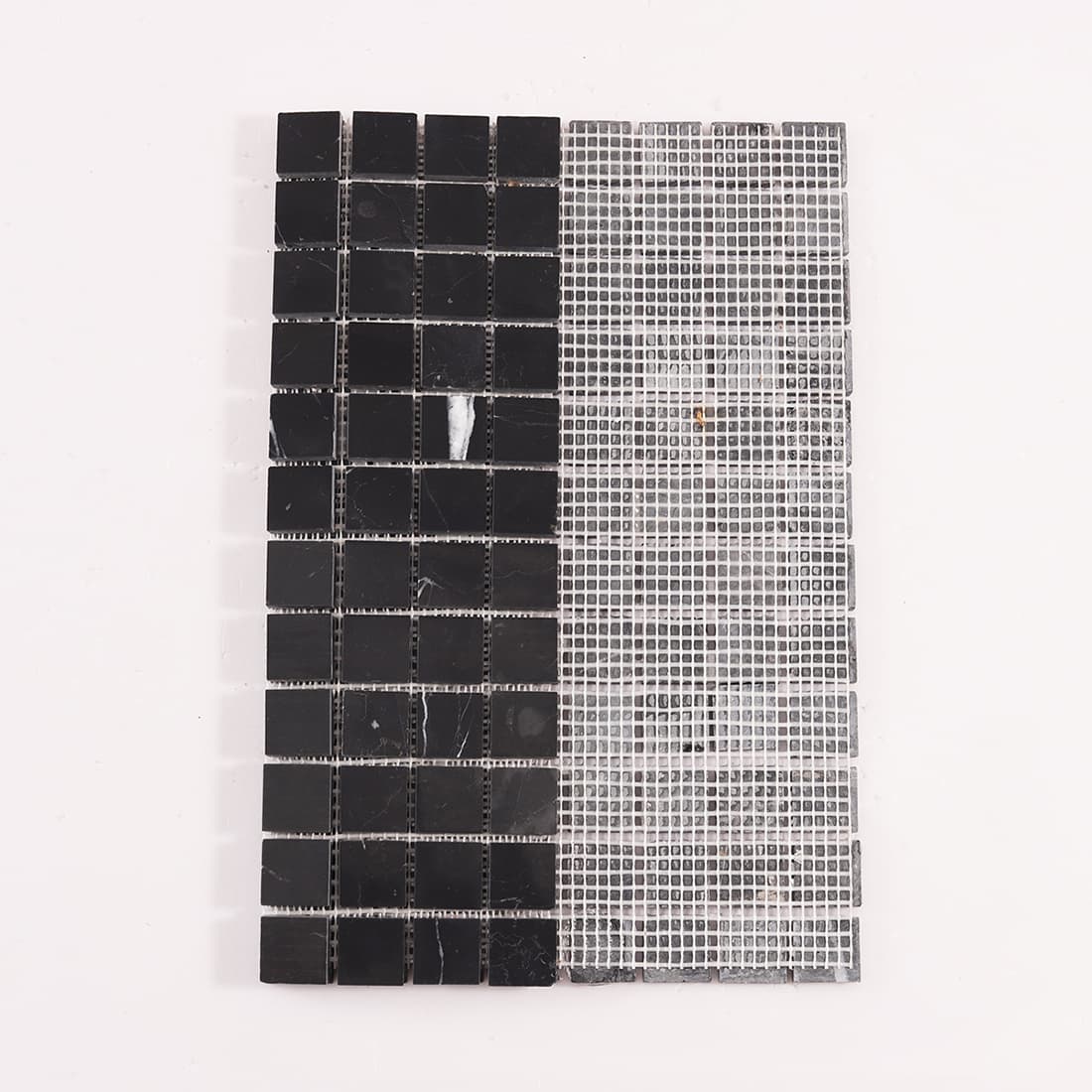 Back view of black marble mosaic tile with mesh backing for easy installation