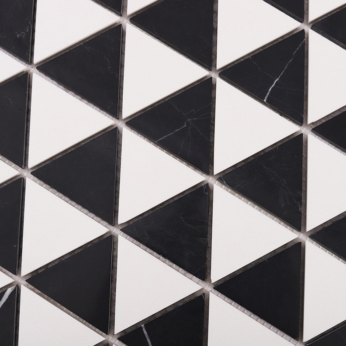 Close up of black and white triangle marble mosaic geometric pattern