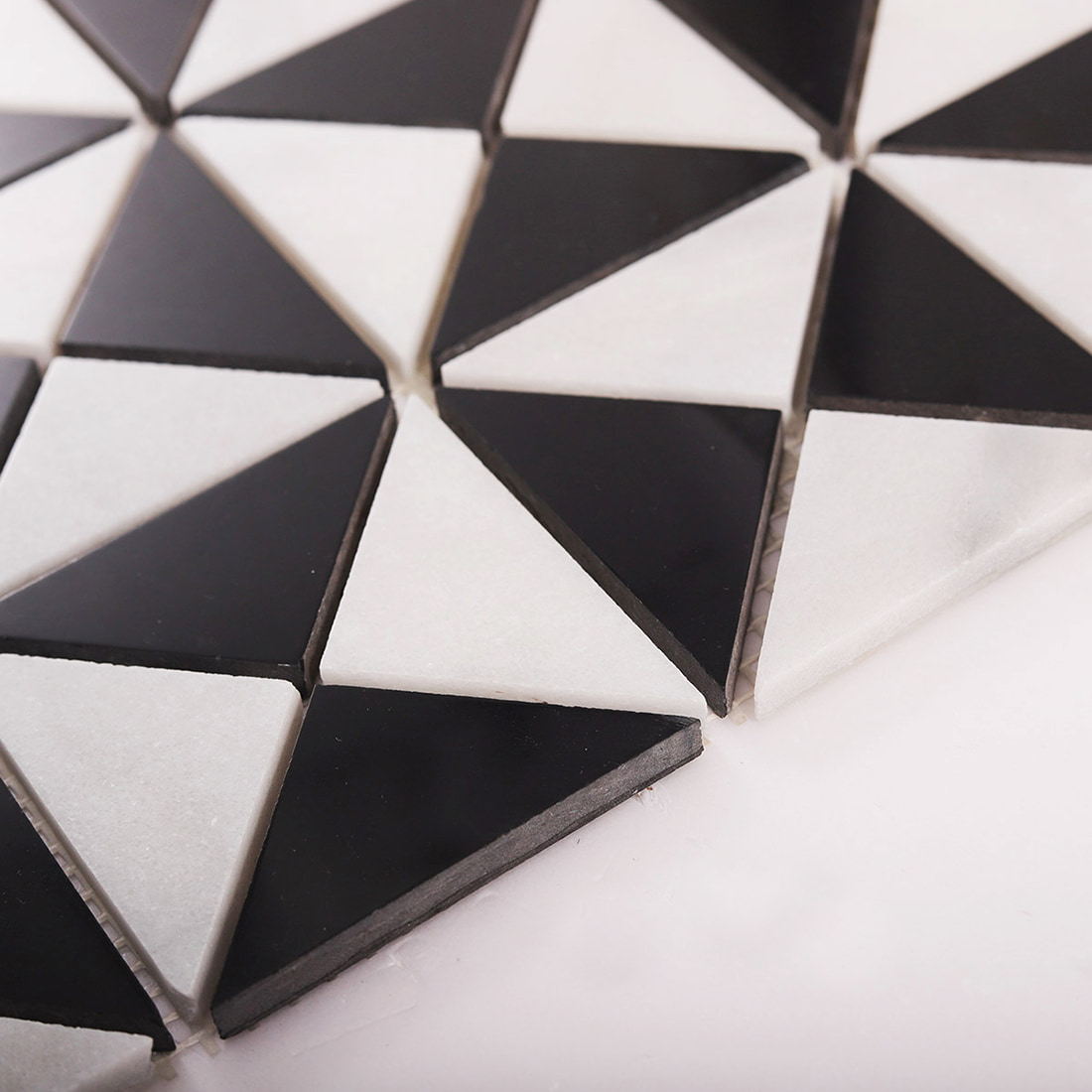 Close up of black and white triangle mosaic pattern with clean spacing