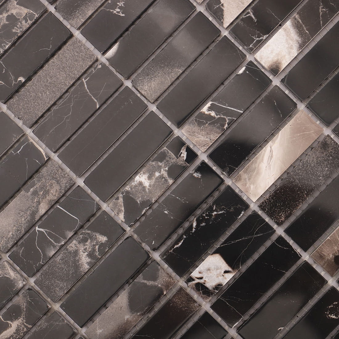 Texture close-up of black marble strip mosaic showing polished surface and veins