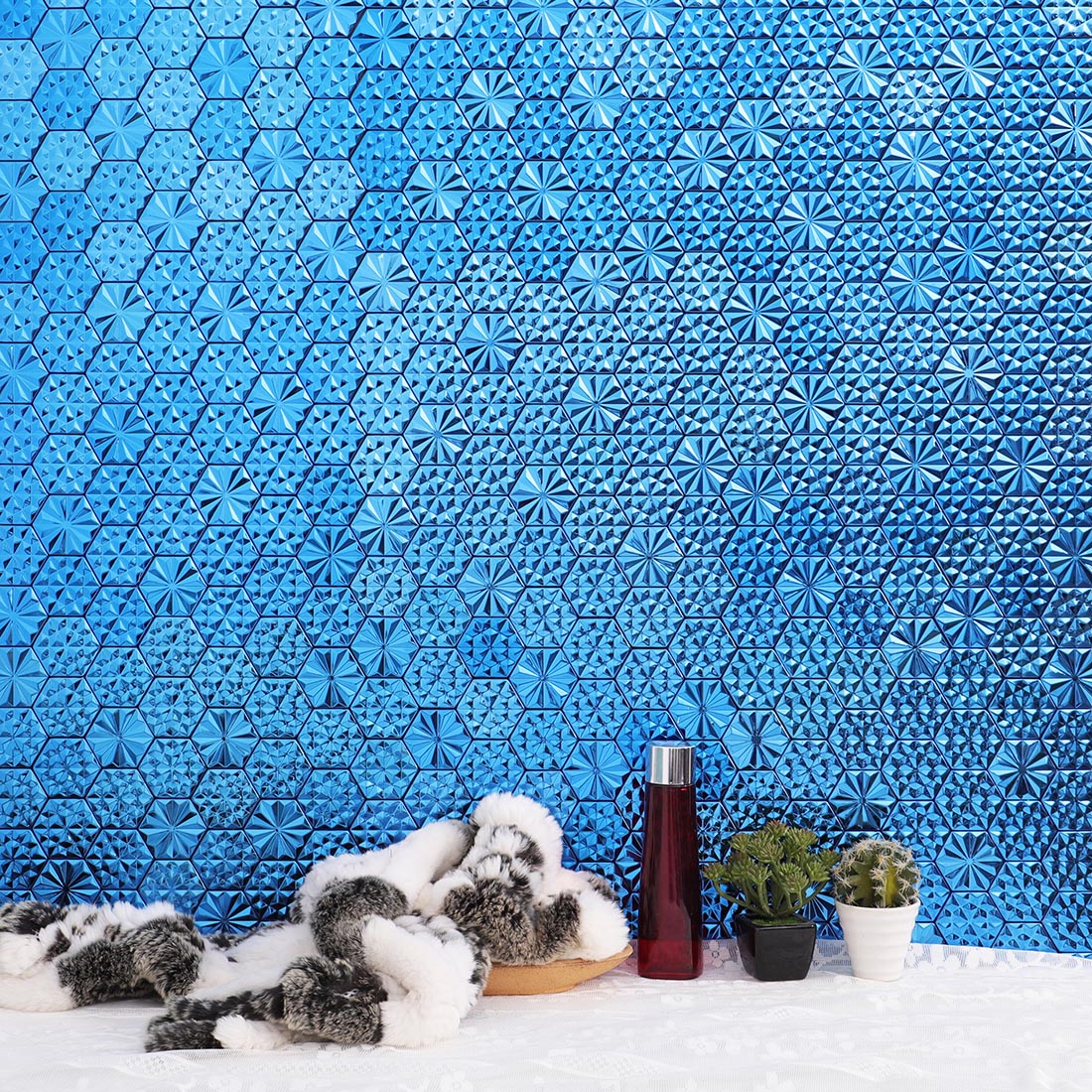 Blue hexagon metal mosaic tile feature wall in a modern interior