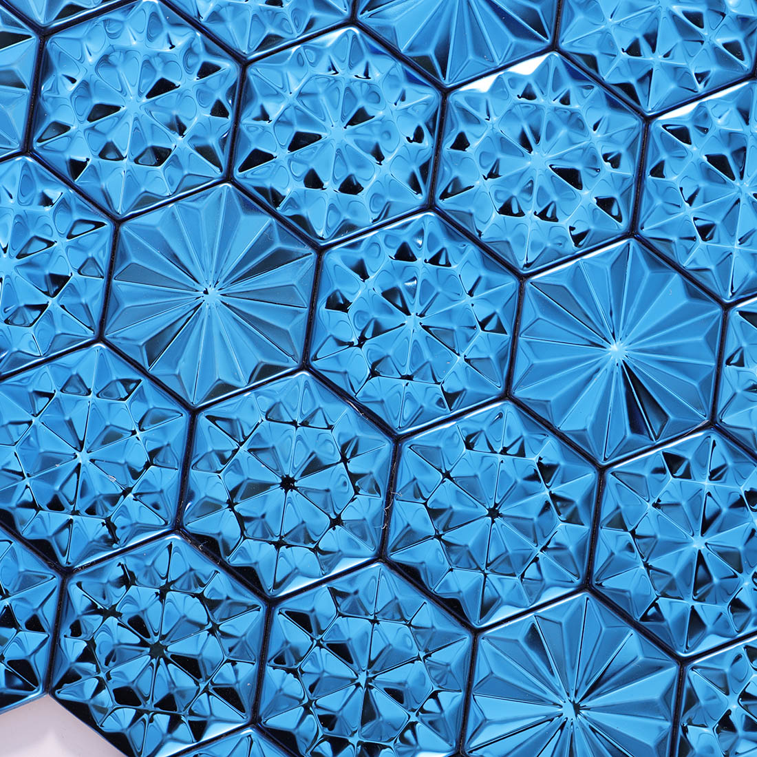 Close-up of glossy blue hexagon metal mosaic tile geometric texture
