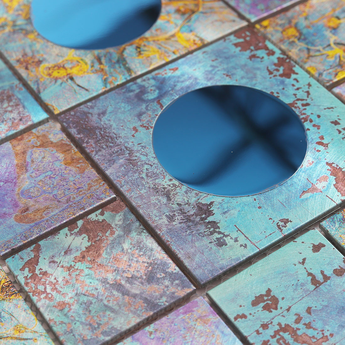 Blue mirror glass circle set in distressed blue aluminum mosaic tile