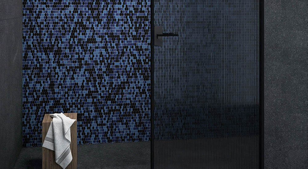 {"default":"Blue and black long hexagon glass mosaic tile on a modern shower wall"}
