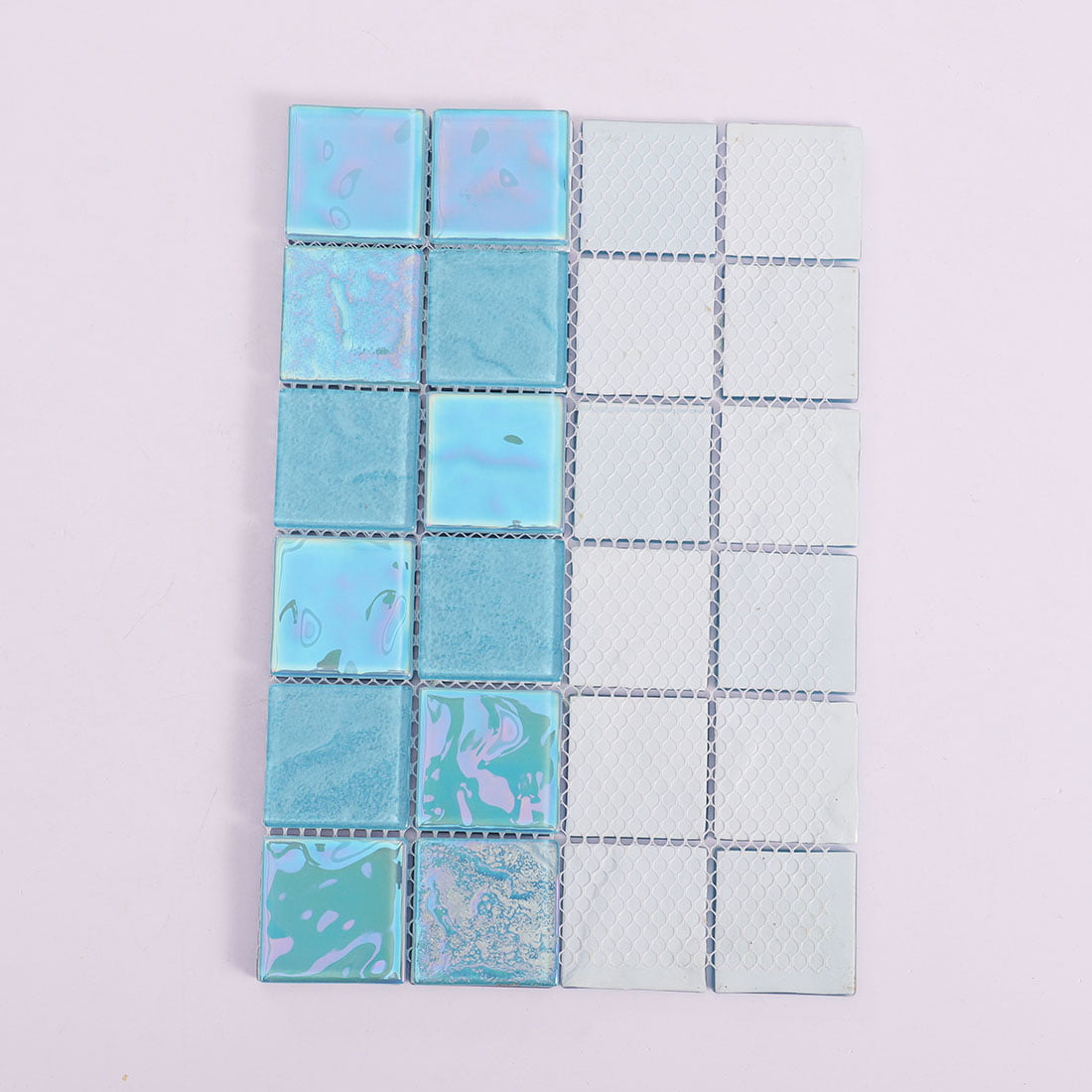 Blue iridescent square glass mosaic tile sheet showing mesh backing