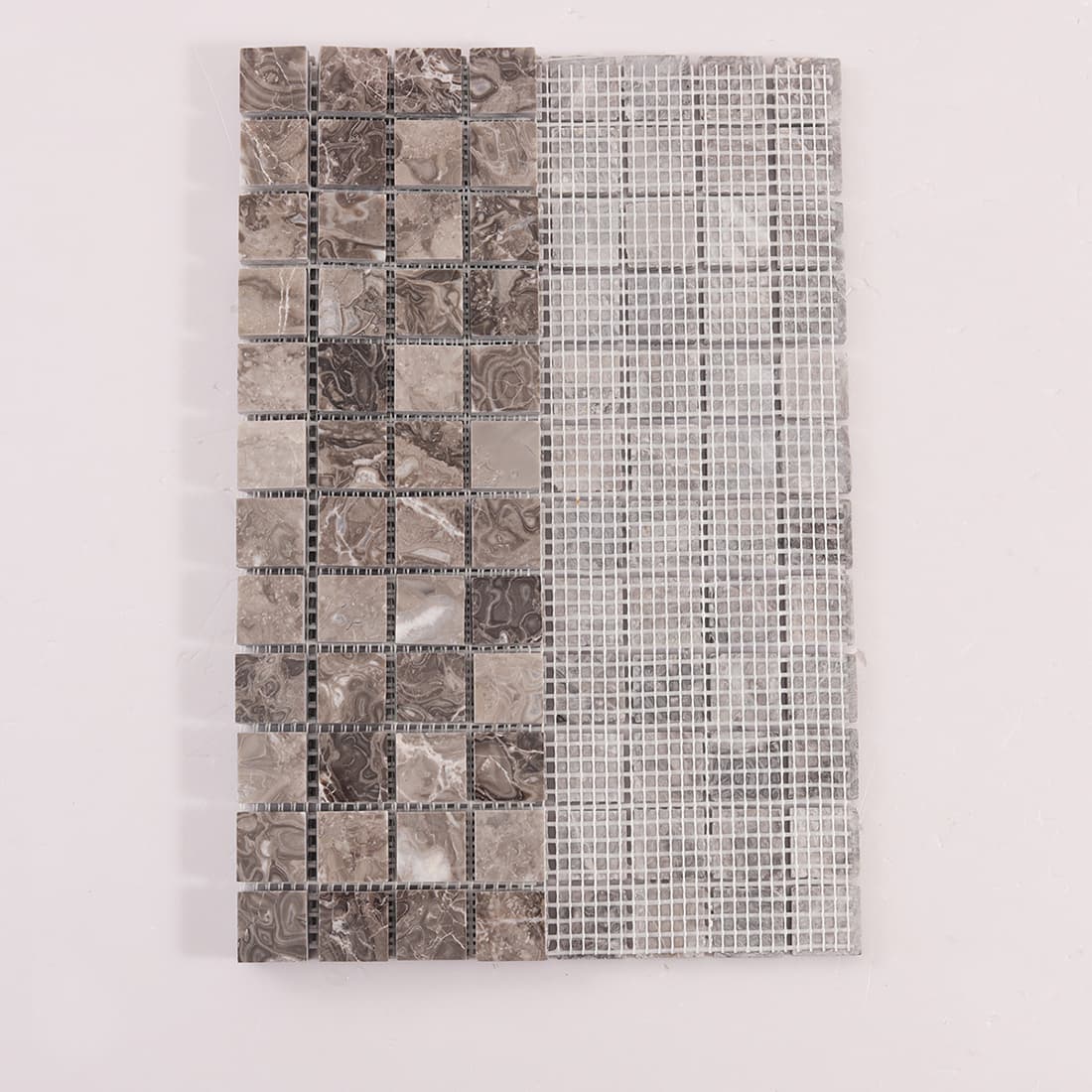 Back view of brown marble square mosaic tiles on fiberglass mesh
