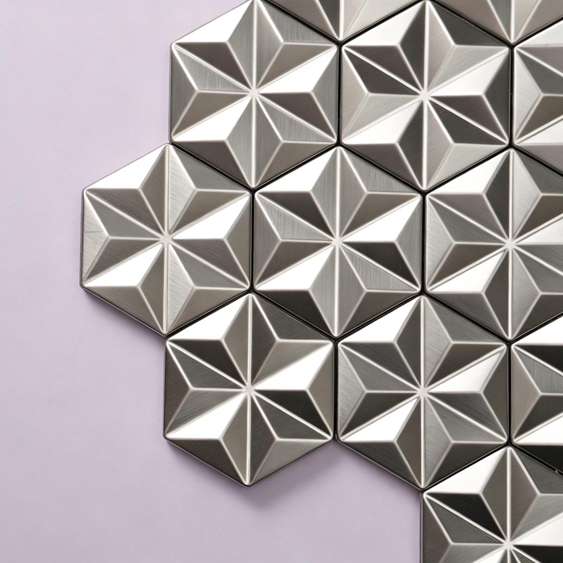 Corner detail of brushed silver hexagon metal mosaic tiles