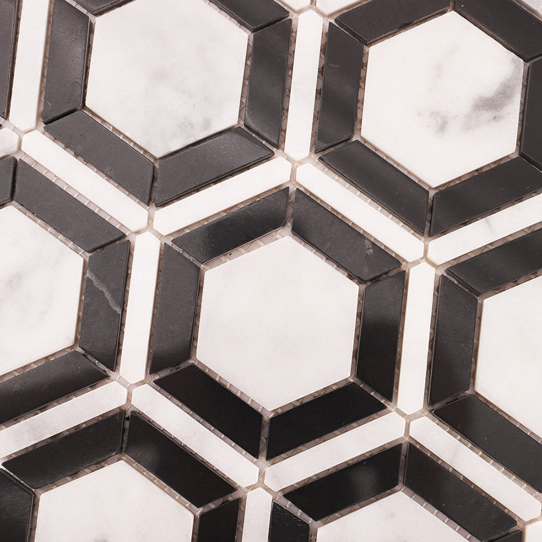 Detailed view of Carrara White and Nero Marquina hexagon marble mosaic pattern