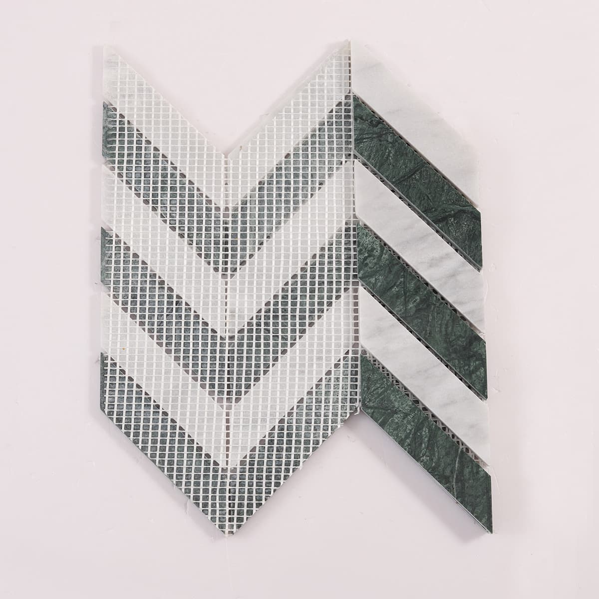 Back view showing mesh backing of green and white chevron marble mosaic