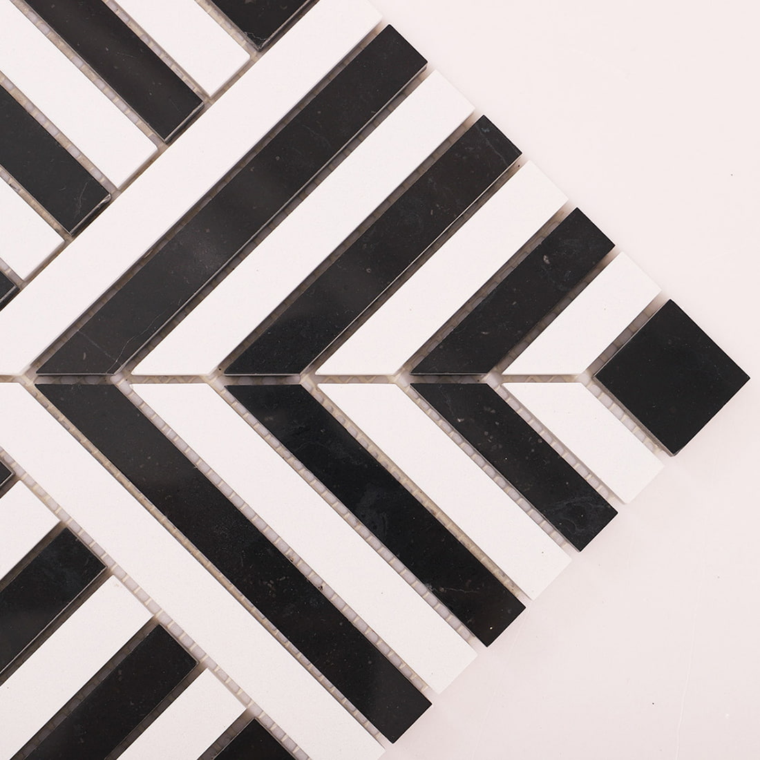 Close up of black and white chevron stripes and square end tile