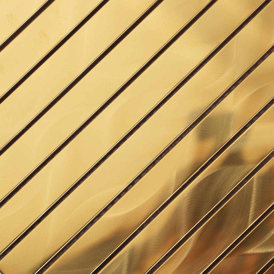 Close-up of brushed gold metal bar tiles showing wavy reflections.