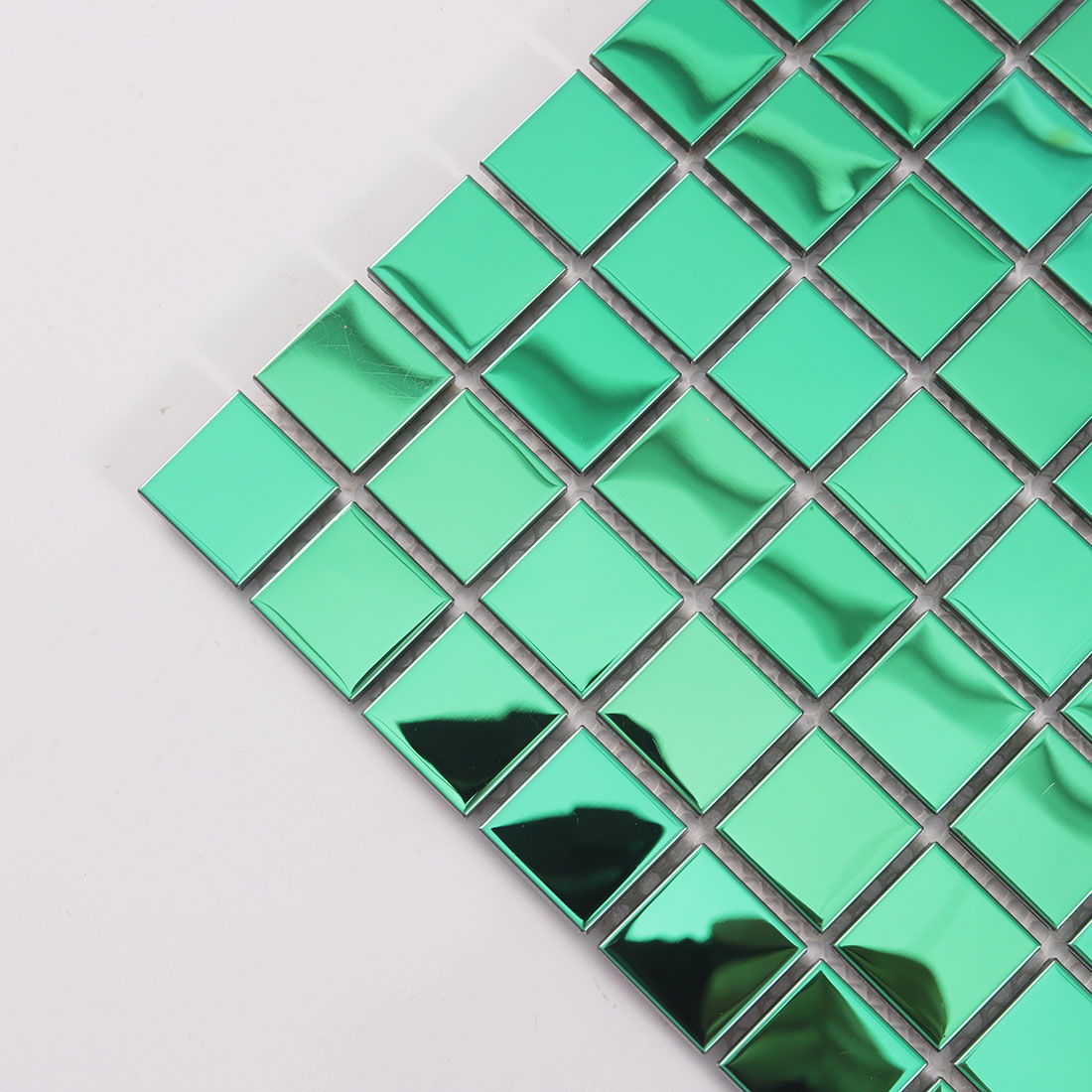 Close-up of green mirror stainless steel mosaic tile with square chips
