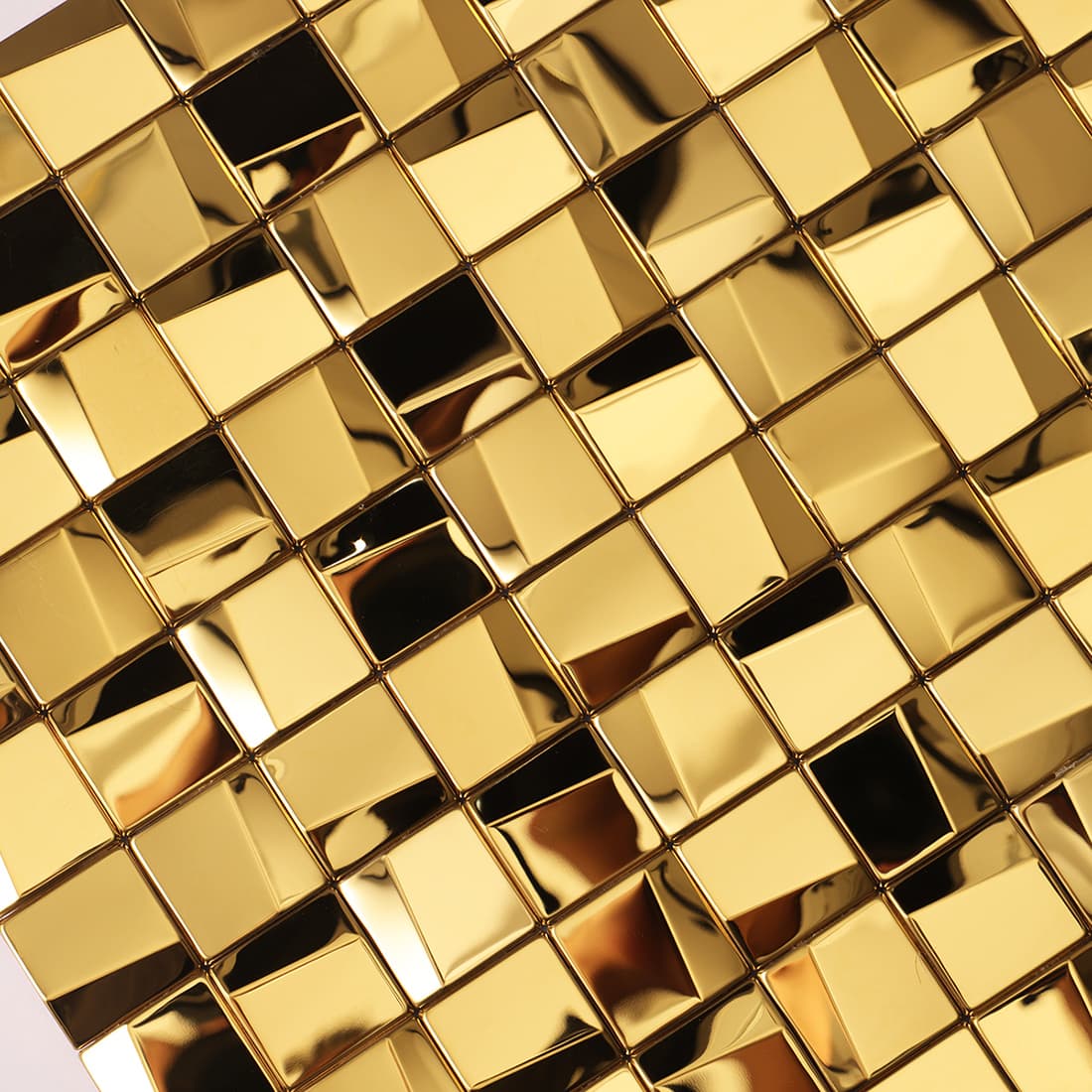 Macro view of a polished gold 3D geometric mosaic tile surface with reflections.