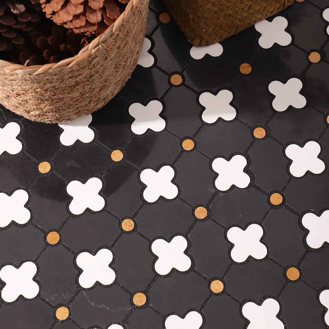 Installed clover mosaic close view with woven baskets and gold dot accents visible