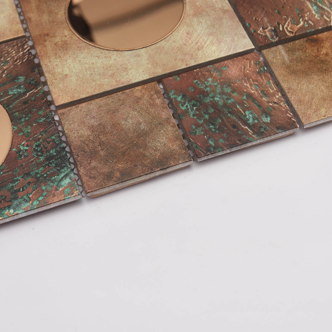 Edge detail of copper aluminum mosaic tile with round mirror glass inserts