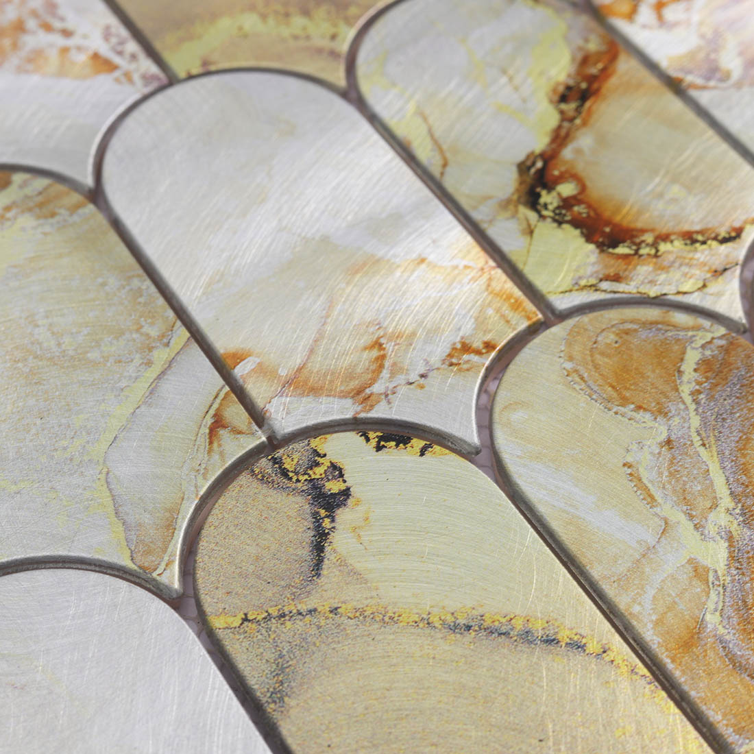 Cream gold aluminum mosaic tile detail with curved edges and stone pattern