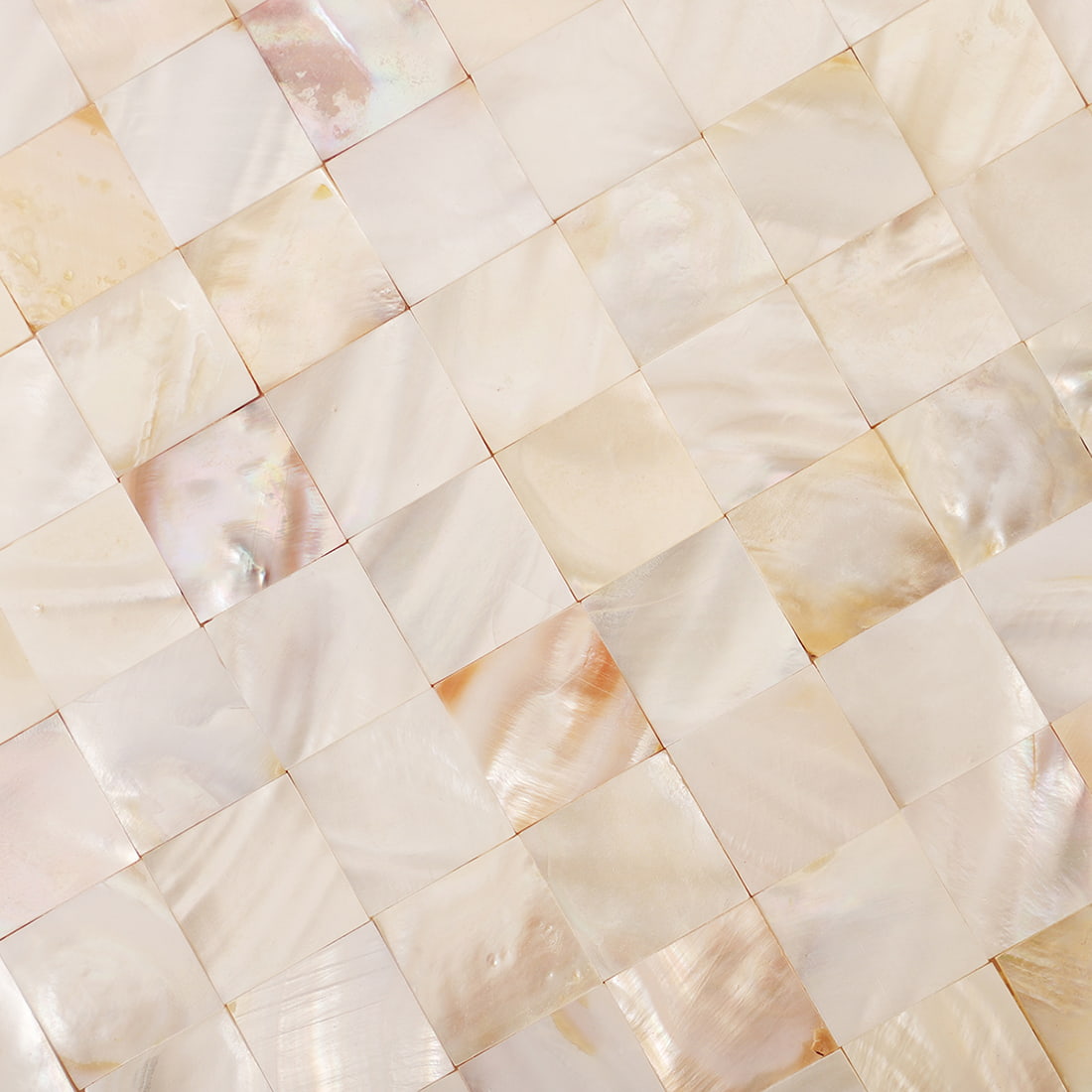 Close up texture of cream white mother of pearl square mosaic tiles