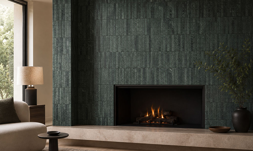 Modern living room fireplace framed by dark green fluted marble tiles
