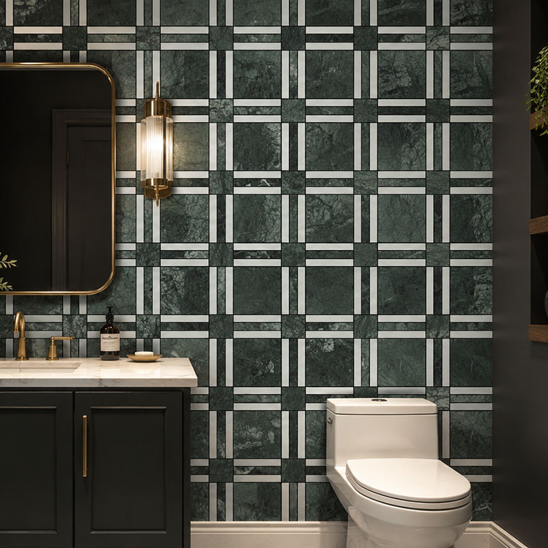 Dark green marble grid tile feature wall with brass accents in powder room