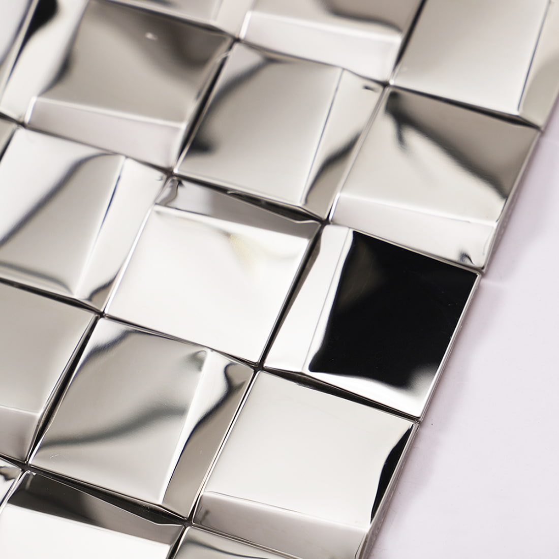 Detailed side view and edge texture of a silver 3D square stainless steel tile.