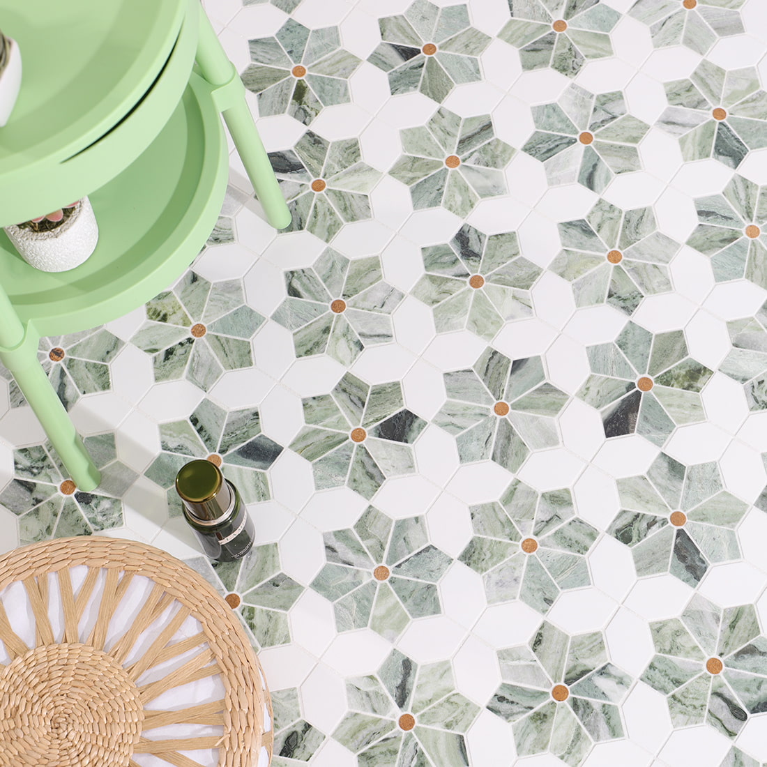 Lifestyle view of flower marble mosaic floor with green stool and decor