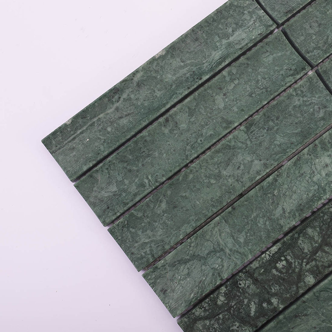 Detail of dark green marble linear strips with subtle white veining