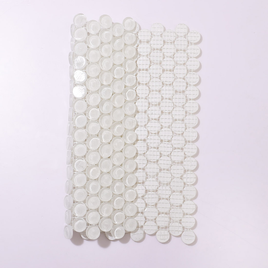 View showing both the glossy front and the mesh backing of the glass tile sheet.