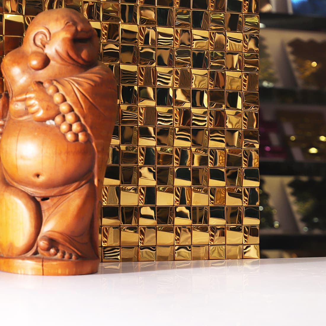 Elegant interior wall featuring gold 3D square stainless steel mosaic tiles.